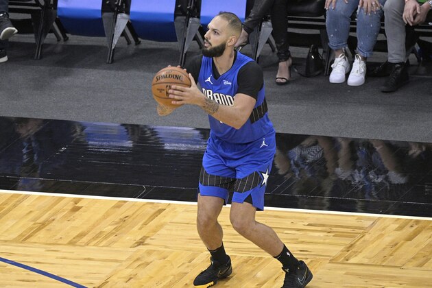 Orlando Magic guard Evan Fournier sets up for a 3-point shot during the first half of the team's NBA basketball game against the Miami Heat, Wednesday, Dec. 23, 2020, in Orlando, Fla. (AP Photo/Phelan M. Ebenhack)