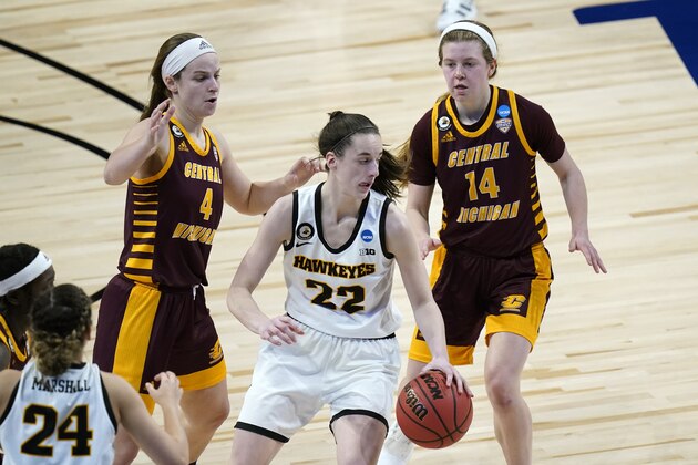 Iowa guard Caitlin Clark (22) drives ahead of Central Michigan guard Maddy Watters (4) and guard Molly Davis (14) during the second half of a college basketball game in the first round of the women's NCAA tournament at the Alamodome, Sunday, March 21, 2021, in San Antonio. (AP Photo/Eric Gay)