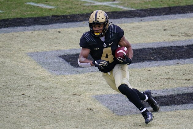 Purdue wide receiver Rondale Moore (4) runs against Nebraska during the first quarter of an NCAA college football game in West Lafayette, Ind., Saturday, Dec. 5, 2020. (AP Photo/Michael Conroy)