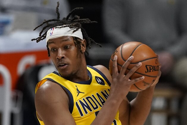 Indiana Pacers center Myles Turner (33) in the second half of an NBA basketball game Monday, March 15, 2021, in Denver. (AP Photo/David Zalubowski)