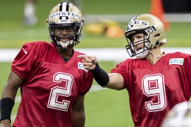 New Orleans Saints quarterback Drew Brees (9) talks with Jameis Winston (2) during an NFL football training camp practice at the Superdome in New Orleans, Saturday, Aug. 29, 2020. (David Grunfeld/The Advocate via AP, Pool)
