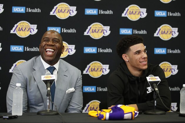 Los Angeles Lakers draft pick Lonzo Ball, right, and Magic Johnson smile as they answer questions during the NBA basketball team's news conference, Friday, June 23, 2017, in El Segundo, Calif. (AP Photo/Jae C. Hong)