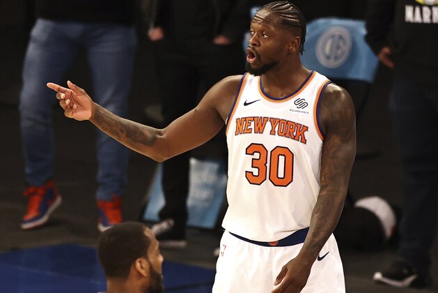 New York Knicks' Julius Randle (30) reacts after he was called for a foul in the final seconds of an NBA basketball overtime period against the Philadelphia 76ers, Sunday, March 21, 2021, in New York. (Elsa/Pool Photo via AP)