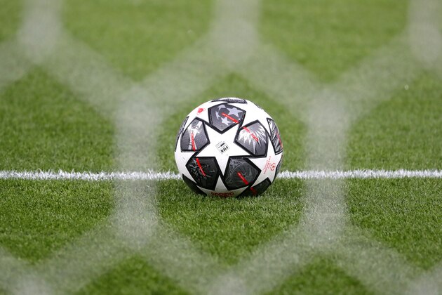 An Adidas Finale Istanbul 21 ball, celebrating the 20th anniversary of the starball design, is seen through the goal net before the Champions League round of 16, first leg, soccer match between RB Leipzig and Liverpool at the Ferenc Puskas stadium in Budapest, Hungary, Tuesday, Feb. 16, 2021. (AP Photo/Laszlo Balogh)