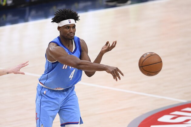 Houston Rockets forward Danuel House Jr. (4) passes during the second half of an NBA basketball game against the Washington Wizards, Monday, Feb. 15, 2021, in Washington. (AP Photo/Nick Wass)