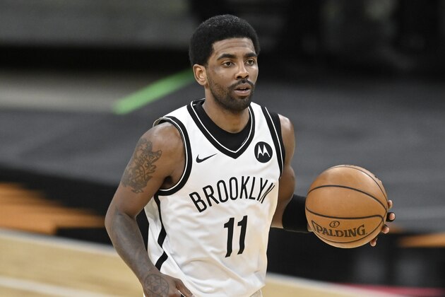 Brooklyn Nets' Kyrie Irving runs up the court during the second half of an NBA basketball game against the San Antonio Spurs, Monday, March 1, 2021, in San Antonio. Brooklyn won 124-113. (AP Photo/Darren Abate)