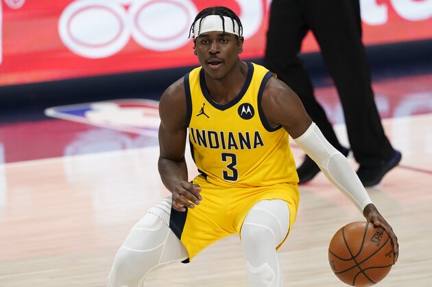Indiana Pacers guard Aaron Holiday (3) in the second half of an NBA basketball game Monday, March 15, 2021, in Denver. The Nuggets won 121-106. (AP Photo/David Zalubowski)