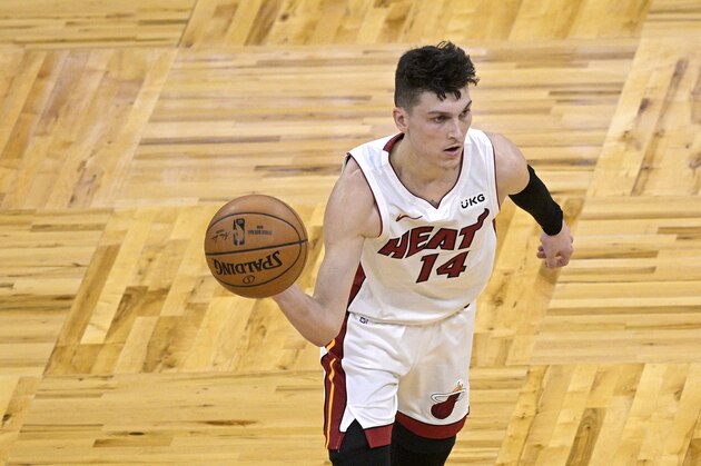Miami Heat guard Tyler Herro (14) passes the ball during the first half of an NBA basketball game against the Orlando Magic on Sunday, March 14, 2021, in Orlando, Fla. (AP Photo/Phelan M. Ebenhack)