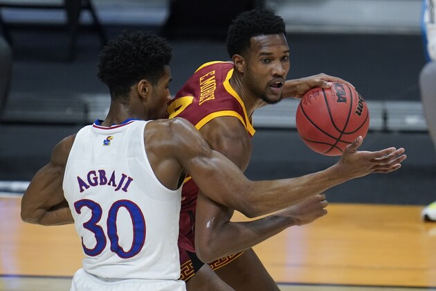 USC forward Evan Mobley (4) drives on Kansas guard Ochai Agbaji (30) during the first half of a men's college basketball game in the second round of the NCAA tournament at Hinkle Fieldhouse in Indianapolis, Monday, March 22, 2021. (AP Photo/Paul Sancya)