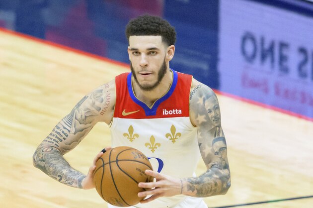 New Orleans Pelicans guard Lonzo Ball (2) passes in the second half of an NBA basketball game against the Cleveland Cavaliers in New Orleans, Friday, March 12, 2021. (AP Photo/Matthew Hinton)