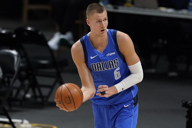 Dallas Mavericks center Kristaps Porzingis (6) in the second half of an NBA basketball game Saturday, March 13, 2021, in Denver. (AP Photo/David Zalubowski)