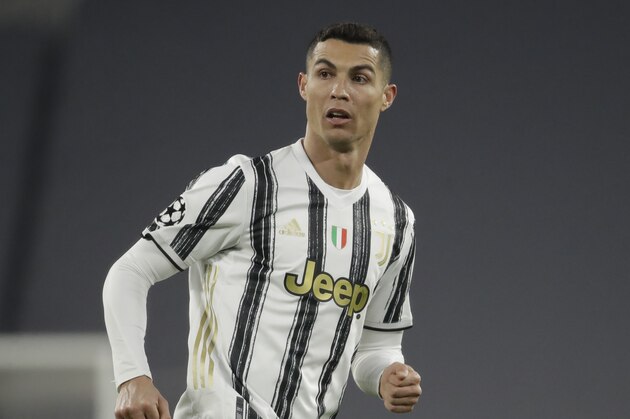 Juventus' Cristiano Ronaldo controls the ball during the Champions League, round of 8, second-leg soccer match between Juventus and Porto at the Allianz stadium in Turin, Italy, Tuesday , March 9, 2021. (AP Photo/Luca Bruno)