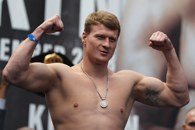 Russia's boxer Alexander Povetkin poses on the weighing scale during the weigh-in at the Business Design Centre in London, Friday, Sept. 21, 2018. Anthony Joshua and Alexander Povetkin are due to fight for the WBA, IBF, WBO and IBO heavyweight title in a boxing match on Saturday, Sept. 22 at Wembley stadium. (AP Photo/Frank Augstein)