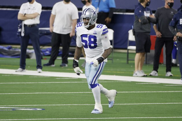 Dallas Cowboys defensive end Aldon Smith (58) runs onto the field during an NFL Football game in Arlington, Texas, Sunday, Dec. 27, 2020. (AP Photo/Michael Ainsworth)
