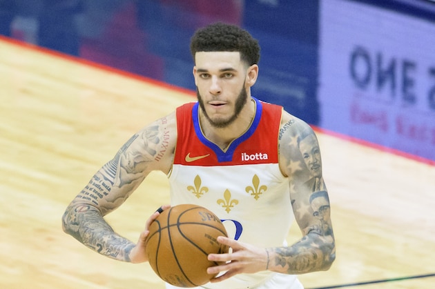 New Orleans Pelicans guard Lonzo Ball (2) passes in the second half of an NBA basketball game against the Cleveland Cavaliers in New Orleans, Friday, March 12, 2021. (AP Photo/Matthew Hinton)