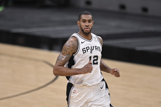 San Antonio Spurs' LaMarcus Aldridge runs up the court during the second half of an NBA basketball game against the Memphis Grizzlies, Saturday, Jan. 30, 2021, in San Antonio. Memphis won 129-112. (AP Photo/Darren Abate)