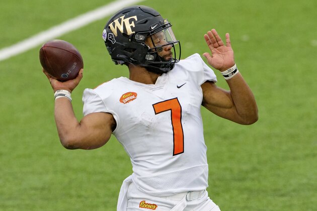 American Team quarterback Jamie Newman of Wake Forest (7) throws during the NCAA Senior Bowl college football game in Mobile, Ala., Saturday, Jan. 30, 2021. (AP Photo/Matthew Hinton)