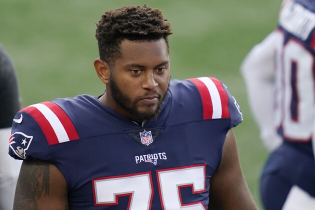 New England Patriots offensive lineman Justin Herron watches from the sideline in the first half of an NFL football game against the San Francisco 49ers, Sunday, Oct. 25, 2020, in Foxborough, Mass. (AP Photo/Charles Krupa)