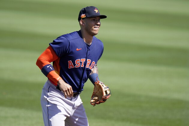 Houston Astros shortstop Carlos Correa waits for a play during a spring training baseball game against the St. Louis Cardinals, Sunday, March 7, 2021, in Jupiter, Fla. (AP Photo/Lynne Sladky)