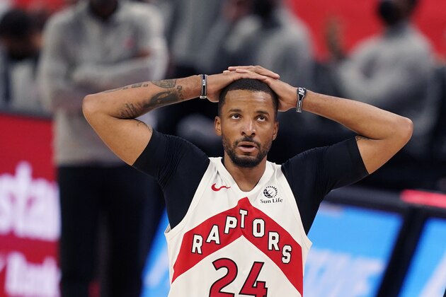 Toronto Raptors guard Norman Powell looks towards the scoreboard during the second half of an NBA basketball game against the Detroit Pistons, Wednesday, March 17, 2021, in Detroit. (AP Photo/Carlos Osorio)