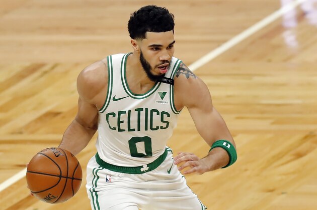 Boston Celtics' Jayson Tatum plays against the Orlando Magic during the first half on an NBA basketball game, Sunday, March 21, 2021, in Boston. (AP Photo/Michael Dwyer)