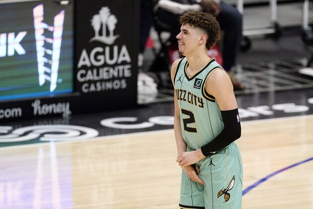 Charlotte Hornets guard LaMelo Ball holds his right wrist during the second half of an NBA basketball game against the Los Angeles Clippers Saturday, March 20, 2021, in Los Angeles. Ball is expected to miss the rest of the season due to a broken right wrist, according to a person familiar with the situation. The person spoke to The Associated Press on Sunday on condition of anonymity because the team has not made the status of his injury public. He appeared to be hurt after a fall in the Hornets' 125-98 loss to the Clippers in Los Angeles on Saturday. (AP Photo/Mark J. Terrill)