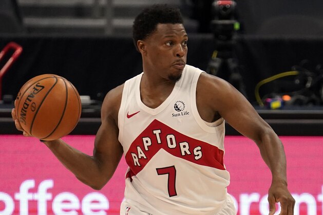Toronto Raptors guard Kyle Lowry (7) moves the ball against the Denver Nuggets during the second half of an NBA basketball game Wednesday, March 24, 2021, in Tampa, Fla. (AP Photo/Chris O'Meara)