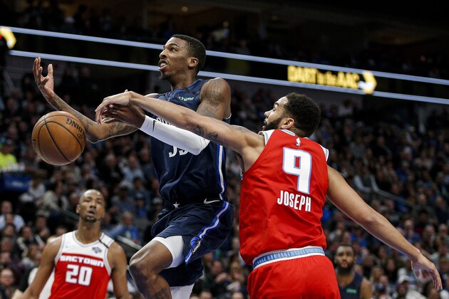 Sacramento Kings guard Cory Joseph (9) knocks the ball away from Dallas Mavericks guard Delon Wright (55) during the first half of an NBA basketball game, Wednesday, Feb. 12, 2020, in Dallas. (AP Photo/Brandon Wade)