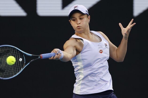 Australia's Ashleigh Barty makes a forehand return to Montenegrin's Danke Kovinic during their first round match at the Australian Open tennis championship in Melbourne, Australia, Tuesday, Feb. 9, 2021. (AP Photo/Rick Rycroft)