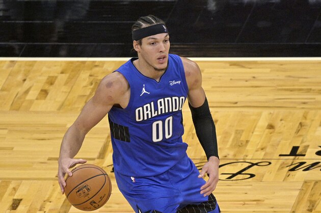 Orlando Magic forward Aaron Gordon (00) looks to pass the ball during the second half of an NBA basketball game against the Sacramento Kings, Wednesday, Jan. 27, 2021, in Orlando, Fla. (AP Photo/Phelan M. Ebenhack)