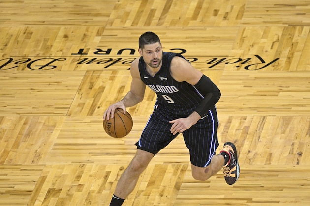 Orlando Magic center Nikola Vucevic (9) sets up a play during the second half of an NBA basketball game against the Miami Heat on Sunday, March 14, 2021, in Orlando, Fla. (AP Photo/Phelan M. Ebenhack)