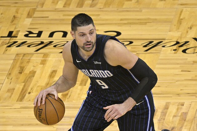 Orlando Magic center Nikola Vucevic (9) sets up a play during the second half of an NBA basketball game against the Miami Heat on Sunday, March 14, 2021, in Orlando, Fla. (AP Photo/Phelan M. Ebenhack)