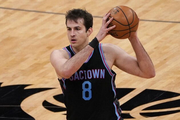 Sacramento Kings forward Nemanja Bjelica looks to pass during the second half of an NBA basketball game against the Miami Heat in Sacramento, Calif., Thursday, Feb. 18, 2021. (AP Photo/Rich Pedroncelli)