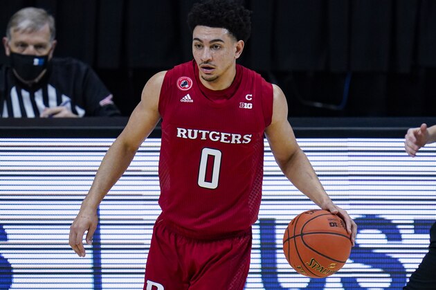 Rutgers guard Geo Baker (0) plays against Illinois in the first half of an NCAA college basketball game at the Big Ten Conference tournament in Indianapolis, Friday, March 12, 2021. (AP Photo/Michael Conroy)