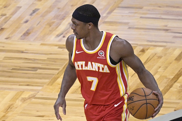 Atlanta Hawks guard Rajon Rondo (7) sets up a play during the second half of an NBA basketball game against the Orlando Magic, Wednesday, March 3, 2021, in Orlando, Fla. (AP Photo/Phelan M. Ebenhack)
