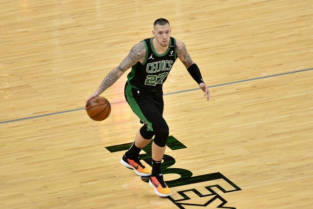 Boston Celtics center Daniel Theis (27) brings the ball up court in the first half of an NBA basketball game against the Memphis Grizzlies Monday, March 22, 2021, in Memphis, Tenn. (AP Photo/Brandon Dill)