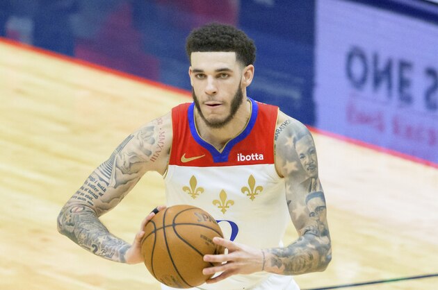 New Orleans Pelicans guard Lonzo Ball (2) passes in the second half of an NBA basketball game against the Cleveland Cavaliers in New Orleans, Friday, March 12, 2021. (AP Photo/Matthew Hinton)