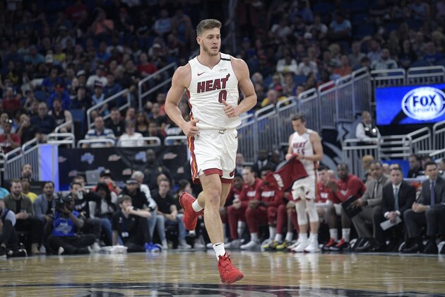 Miami Heat forward Meyers Leonard (0) runs up the court after a play during the first half of an NBA basketball game against the Orlando Magic Friday, Jan. 3, 2020, in Orlando, Fla. (AP Photo/Phelan M. Ebenhack)