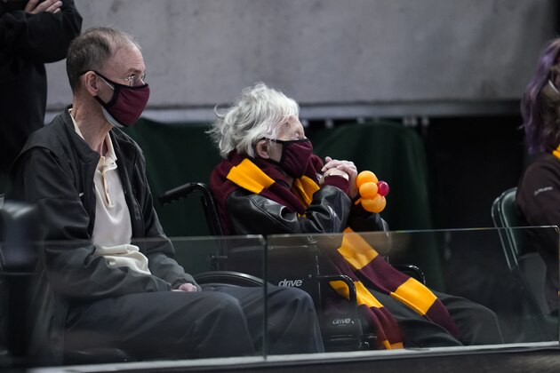 Sister Jean Dolores Schmidt watches Loyola Chicago play Illinois during the first half of a men's college basketball game in the second round of the NCAA tournament at Bankers Life Fieldhouse in Indianapolis, Sunday, March 21, 2021. (AP Photo/Paul Sancya)