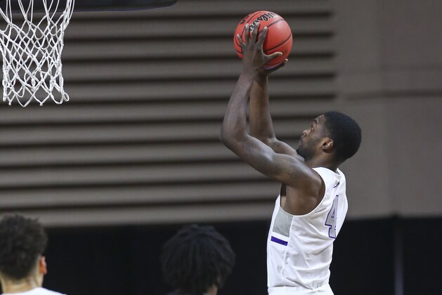 Grand Canyon's Oscar Frayer (4) lays up the ball against New Mexico State during the first half of an NCAA college basketball game for the championship of the Western Athletic Conference men's tournament Saturday, March 13, 2021, in Las Vegas. (AP Photo/Chase Stevens)