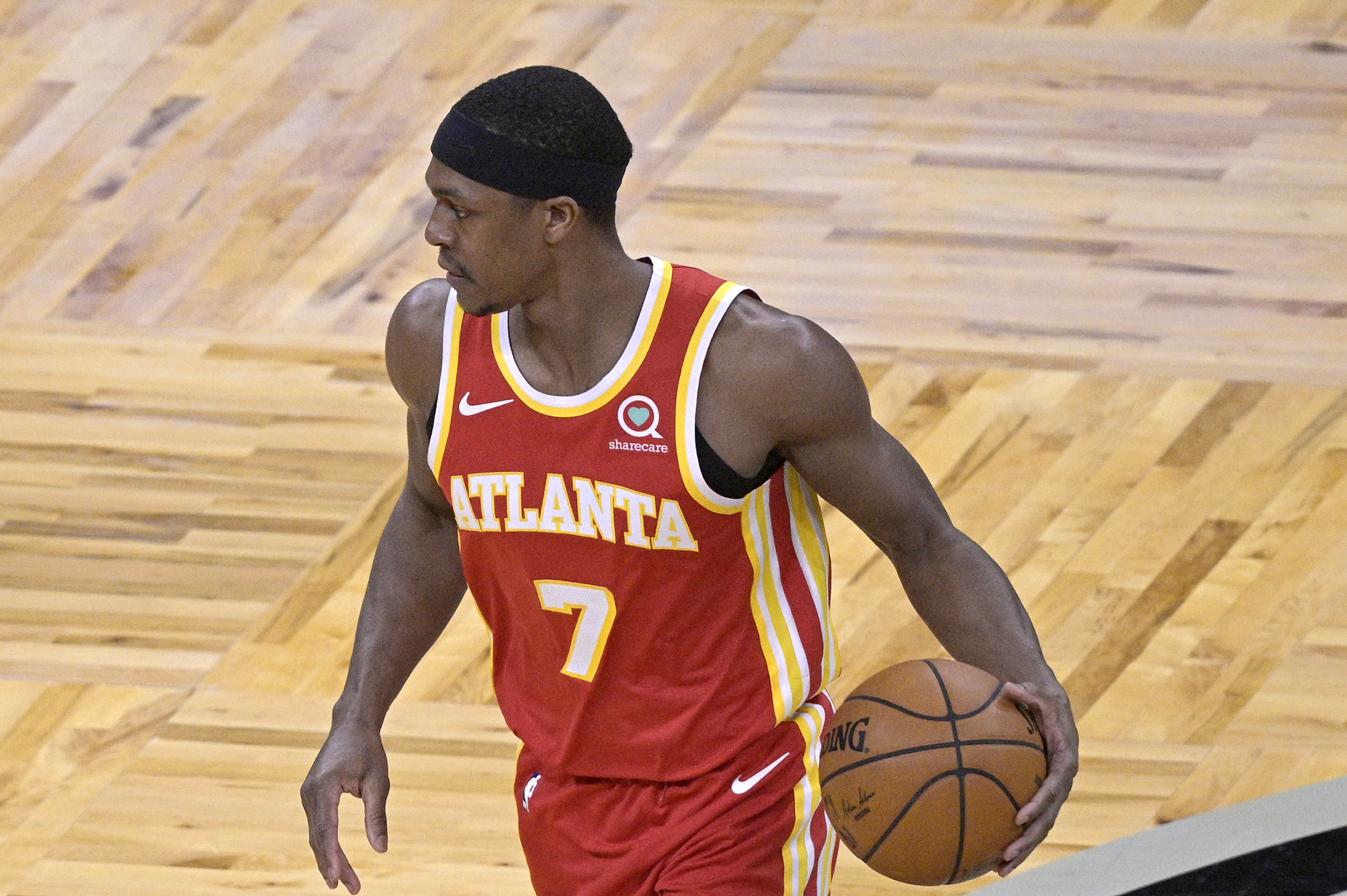Atlanta Hawks guard Rajon Rondo (7) sets up a play during the second half of an NBA basketball game against the Orlando Magic, Wednesday, March 3, 2021, in Orlando, Fla. (AP Photo/Phelan M. Ebenhack)