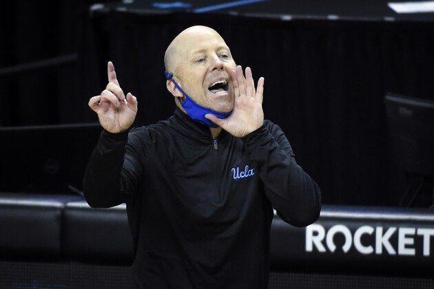 UCLA head coach Mick Cronin communicates with his team during the first half of an NCAA college basketball game Wedesday, March 3, 2021, in Eugene, Ore. (AP Photo/Andy Nelson)