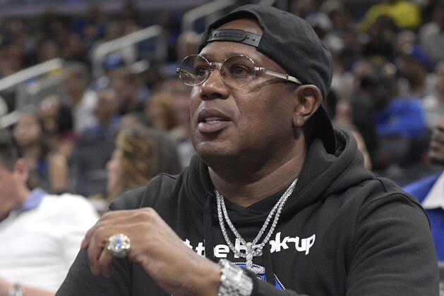 FILE - In this Dec. 1, 2017 file photo Master P watches from a court side seat during the first half of an NBA basketball game between the Orlando Magic and the Golden State Warriors in Orlando, Fla. The rapper and businessman said he will pay for the funeral of a 3-year-old Kentucky girl who was fatally shot along with her father on Friday, Aug. 14, 2020, in Louisville. (AP Photo/Phelan M. Ebenhack, File)