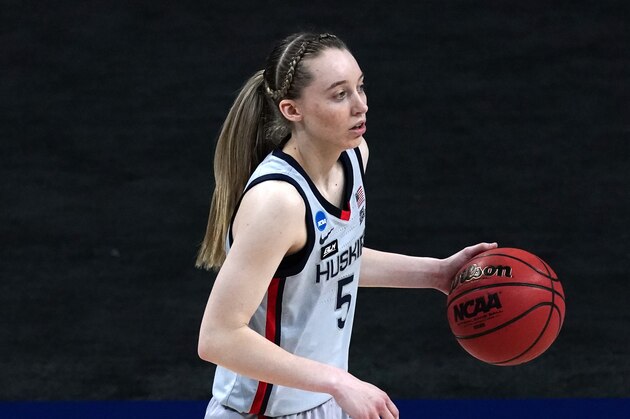 UConn guard Paige Bueckers drives during the first half of a college basketball game against Syracuse in the second round of the women's NCAA tournament at the Alamodome in San Antonio, Tuesday, March 23, 2021. (AP Photo/Charlie Riedel)