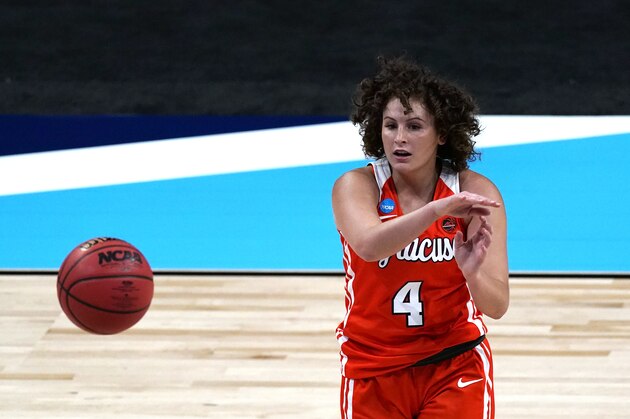 Syracuse guard Tiana Mangakahia passes during the first half of a college basketball game against UConn in the second round of the women's NCAA tournament at the Alamodome in San Antonio, Tuesday, March 23, 2021. (AP Photo/Charlie Riedel)