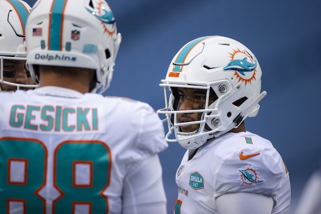 Miami Dolphins quarterback Tua Tagovailoa (1) stands in a huddle during the first quarter of an NFL football game against the Buffalo Bills, Sunday, Jan. 3, 2021, in Orchard Park, N.Y. (AP Photo/Brett Carlsen) Miami Dolphins quarterback Tua Tagovailoa (1) stands in a huddle during the first quarter of an NFL football game against the Buffalo Bills, Sunday, Jan. 3, 2021, in Orchard Park, N.Y. (AP Photo/Brett Carlsen)