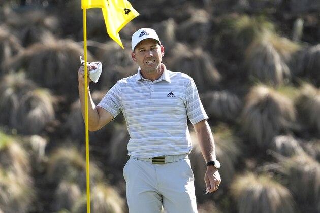 Sergio Garcia, of Spain, celebrates as he take his ball out of the cup after making a hole in one on the fourth hole to win his playoff against Lee Westwood, of England, during a third round match at the Dell Technologies Match Play Championship golf tournament Friday, March 26, 2021, in Austin, Texas. (AP Photo/David J. Phillip) Sergio Garcia, of Spain, celebrates as he take his ball out of the cup after making a hole in one on the fourth hole to win his playoff against Lee Westwood, of England, during a third round match at the Dell Technologies Match Play Championship golf tournament Friday, March 26, 2021, in Austin, Texas. (AP Photo/David J. Phillip)
