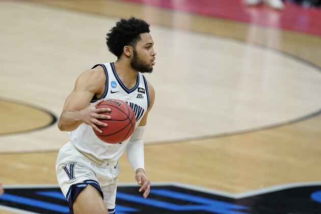 Villanova's Caleb Daniels (14) dribbles during the first half of a second-round game against North Texas in the NCAA men's college basketball tournament at Bankers Life Fieldhouse, Sunday, March 21, 2021, in Indianapolis. (AP Photo/Darron Cummings)