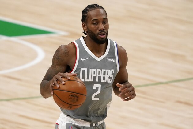 Los Angeles Clippers' Kawhi Leonard advances the ball up court during an NBA basketball game against the Dallas Mavericks in Dallas, Wednesday, March 17, 2021. (AP Photo/Tony Gutierrez)