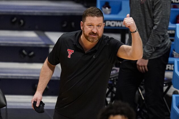 Texas Tech head coach Chris Beard signals to his team as they played against Arkansas in the first half of a second-round game in the NCAA men's college basketball tournament at Hinkle Fieldhouse in Indianapolis, Sunday, March 21, 2021. (AP Photo/Michael Conroy)
